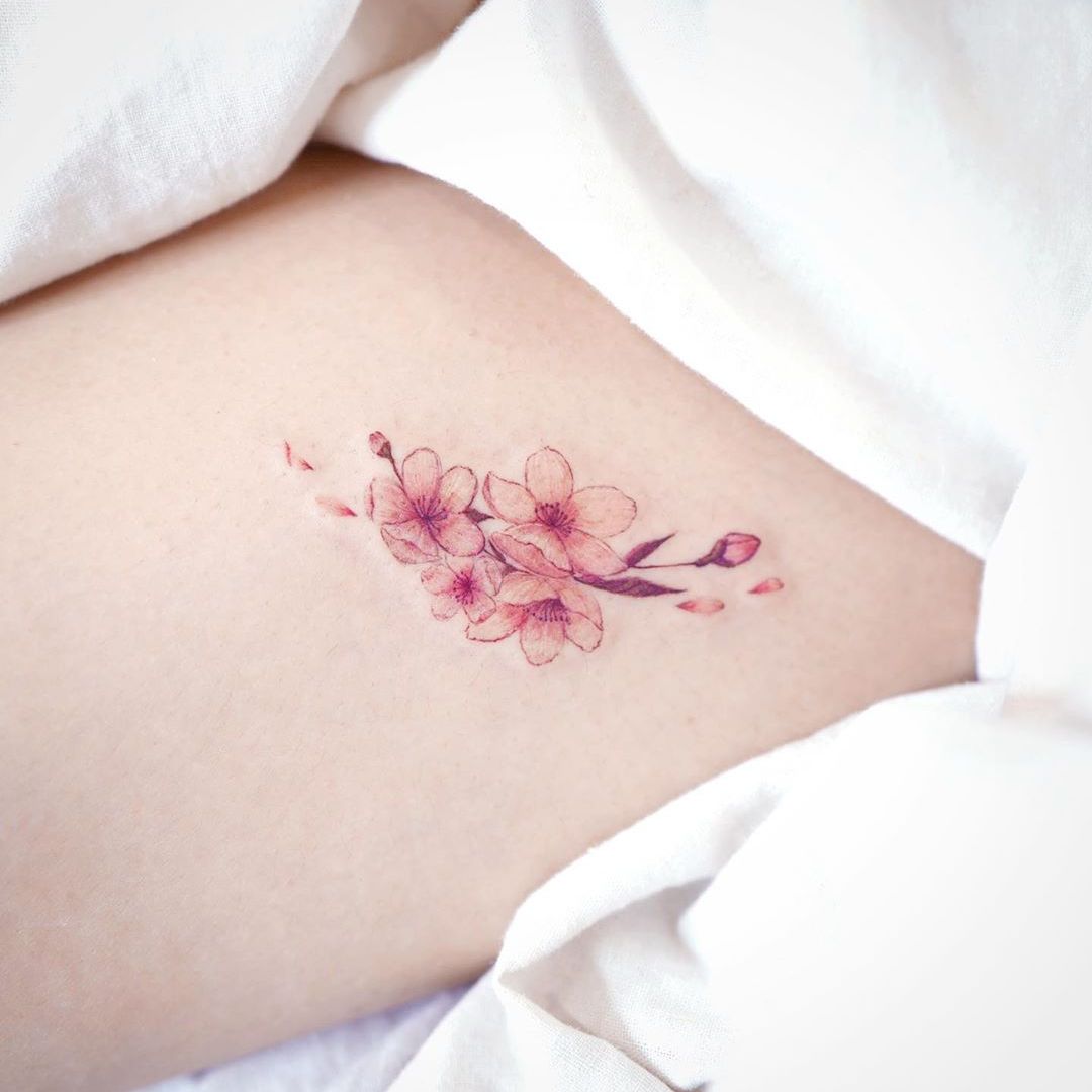 Tattoo uploaded by Tattoodo • Cherry blossom tattoo by March Tattoo #MarchTattoo #cherryblossomtattoos #cherryblossom #flowers #floral #nature #plant #cherryblossomtattoo #color #fineline #watercolor #minimal #small #tiny #petals #pink • Tattoodo