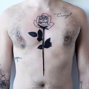 Tattoo by Wolf Rosario #blackwork #blackworktattoo #rose #skull #chesttattoo