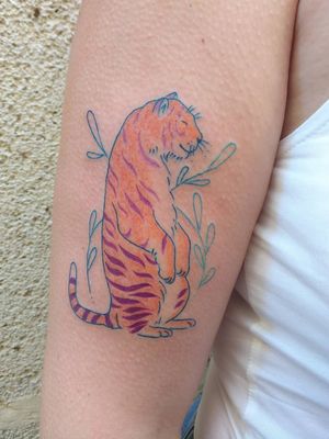 Illustrative tattoo by Katie Mcpayne #KatieMcpayne #illustrative #linework #queertattooer #vegantattoo #colortattoo #fineline #tiger #cat #junglecat #plants #floral #nature #arm