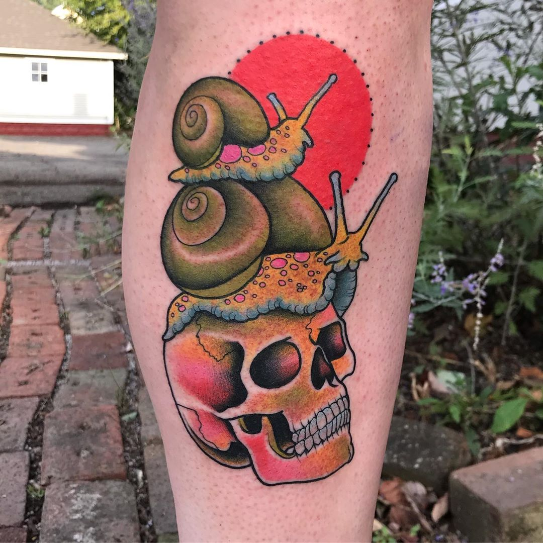 Arm Skull Snail Tattoo by Bloody Blue Tattoo