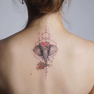Elephant tattoo by Tattooist Silo #TattooistSilo #TattoodoApp #tattooartist #tattooart #tattooidea #inspiringtattoo #besttattoo #awesometattoo #floral #flower #sacredgeometry #elephant #animal #back