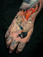 Hand tattoo by Aimee Cornwell #AimeeCornwell #LondonTattooConvention #LondonTattooConvention2019 #London #tattooconvention #color #painterly #bird #feathers #hand