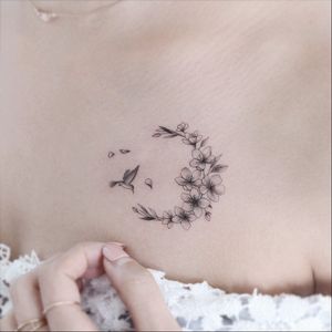 Cherry blossom tattoo by Tattooist Greem #TattooistGreem #cherryblossomtattoos #cherryblossom #flowers #floral #nature #plant #cherryblossomtattoo #illustrative #linework #fineline #hummingbird #chesttattoo #small