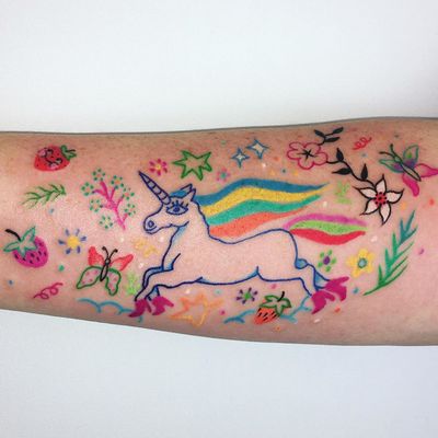 Unicorn tattoo by Charline Bataille #CharlineBataille #coverupsagainstabuse #coveruptattoos #coverup #tattoocommunity #tattooartist #unicorn #butterfly #flower #floral #stars #rainbow #arm #illustrative #color