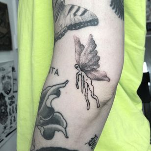 Handpoke tattoo by Sabrina Drescher #SabrinaDrescher #coverupsagainstabuse #coveruptattoos #coverup #tattoocommunity #tattooartist #handpoke #blackwork #dotwork #handpoketattoo #wings #fairy #surreal #arm