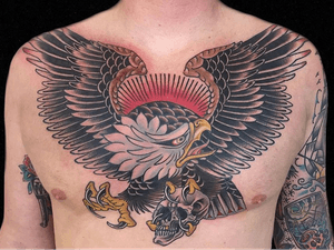 Eagle tattoo by Hanna Sandstrom #HannaSandstrom #DarkAgeSeattle #Seattle #traditional #eagle #wings #feathers #skull #color #traditionaltattoo #chesttattoo #chestpiece