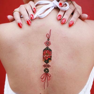 Norigae and peony tattoo by Tattooist Sion #TattooistSion #TattoodoApp #tattooartist #tattooart #tattooidea #inspiringtattoo #besttattoo #awesometattoo #norigae #ornamental #pattern #peony #flower #floral #back