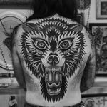 Wolf tattoo by Austin Maples #AustinMaples #wolftattoo #wolftattoos #wolf #animal #nature #wolves #traditional #backtattoo #backpiece #traditionalwolftattoo #back