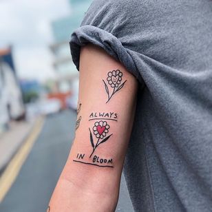 Flower tattoo by Harry McKenzie #HarryMcKenzie #coverupsagainstabuse #coveruptattoos #coverup #tattoocommunity #tattooartist #illustrative #flower #floral #lettering #quote #writing #heart #bloom #arm
