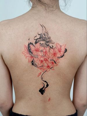 Cherry blossom tattoo by Bium Tattoo #BiumTattoo #cherryblossomtattoos #cherryblossom #flowers #floral #nature #plant #cherryblossomtattoo #illustrative #dragon #japanese #fire #petals #redink
