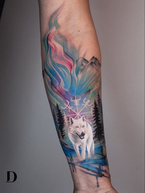 Wolf tattoo by Deborah Genchi #DeborahGenchi #wolftattoo #wolftattoos #wolf #animal #nature #wolves #auroraborealis #vikingcompass #watercolor #forest #arm #watercolorwolftattoo #realism #realistic