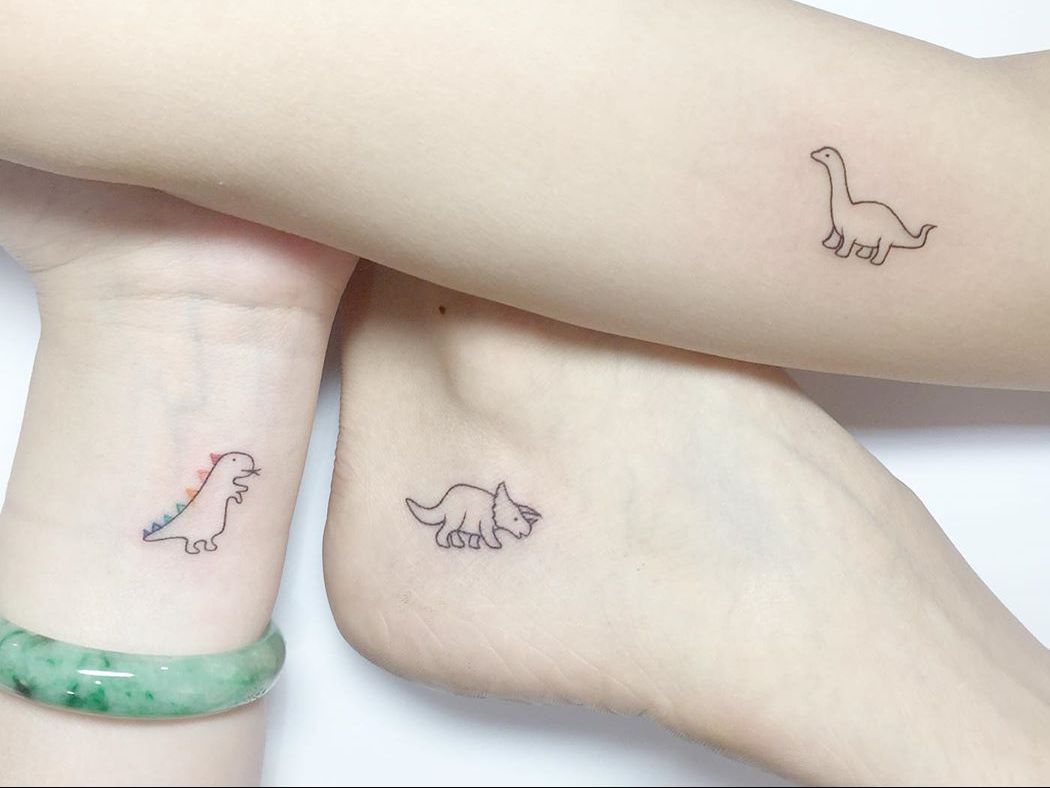 couples tattoo dinosaur matching writing tattoo small black  Reds Tattoo