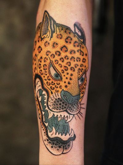 Leopard tattoo by Damien J Thorn #DamienJThorn #TattoodoApp #tattooartist #tattooart #tattooidea #inspiringtattoo #besttattoo #awesometattoo #japanese #neojapanese #leopard #color #illustrative #arm