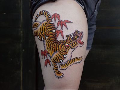 Tiger tattoo by Andrei Vintikov #AndreiVintikov #tattooartist #tattoodo #tattoodoapp #awesometattoo #besttattoo #tiger #tigertattoo #junglecat #mapleleaves #mapleleaf #cat #leg #color #japanese