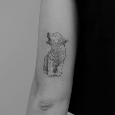 Wolf tattoo by Minnie Tattooart #MinnieTattooart #MinnieTattoo #wolftattoo #wolftattoos #wolf #animal #nature #wolves #illustrative #linework #fineline #illustrativewolftattoo #realistic #cute #babyanimal #arm