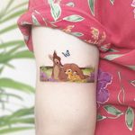 Bambi tattoo by Kozo Tattoo #KozoTattoo #tattooideas #tattooidea #tattooinspiration #tattoodesign #tattoodesignidea #tattooinspo #newschool #bambi #disney #butterfly #cartoon #color #arm