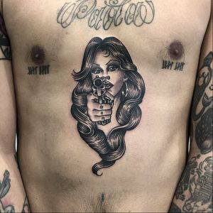 Chicano tattoo by Alejandro Lopez #AlejandroLopez #TattoodoApp #tattooartist #tattooart #tattooidea #inspiringtattoo #besttattoo #awesometattoo #blackandgrey #chicano #lady #pinup #gun #chest #stomach