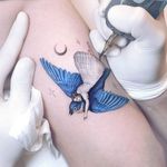 Surreal tattoo by Eden Kozo aka Kozo Tattoo #KozoTattoo #EdenKozo #besttimetogettattooed #gettattooed #winter #besttattoos #sparrow #bluebird #bird #surreal #portrait #nature #stars #moon #illustrative #arm
