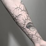 Thorn tattoo by 10in Tattoo #10intattoo #thorntattoo #thorntattoos #thorn #plant #nature #pain #arm #blackwork #cracks #opticalillusion