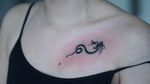 Tiny tribal dragon tattoo by Mina Aoki #MinaAoki #small #tiny #smalldragontattoo #smalltattoo #tinytattoo #microtattoo #tribal #tribaltattoo #dragontattoos #dragontattoo #dragon #mythicalcreature #myth #legend #magic #fable