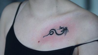 Tiny tribal dragon tattoo by Mina Aoki #MinaAoki #small #tiny #smalldragontattoo #smalltattoo #tinytattoo #microtattoo #tribal #tribaltattoo #dragontattoos #dragontattoo #dragon #mythicalcreature #myth #legend #magic #fable