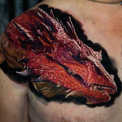 Smaug tattoo by Sebastian Carrasco #SebastianCarrasco #smaug #smaugtattoo #hobbit #dragontattoos #dragontattoo #dragon #mythicalcreature #myth #legend #magic #fable