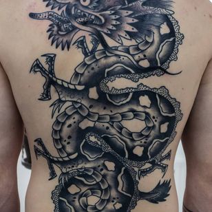 Dagon tattoo by Tattoo Sved #Tattoosved #traditional #blackandgrey #backtattoo #backpiece #dragontattoos #dragontattoo #dragon #mythicalcreature #myth #legend #magic #fable