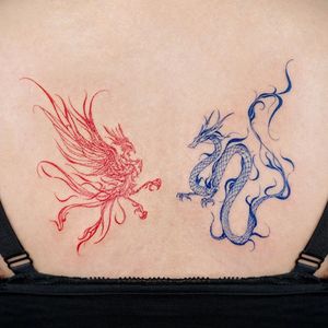 Tribal dragon tattoo by Bium tattoo #bium #biumtattoo #tribaldragontattoo #color #red #blue #fire #dragontattoos #dragontattoo #dragon #mythicalcreature #myth #legend #magic #fable