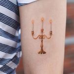 Candle tattoo by Saegeem #Saegeem #candle #candelabra #illustrative #realism #flame #gold 