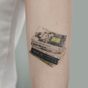 Favorite books tattoo by Sol Tattoo #SolTattoo #books #illustrative #realism #book #library #reading #literature 