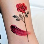 Paint and rose tattoo by Tattooist Cozy #TattooistCozy #rose #paint #brushstroke #realism #flower 