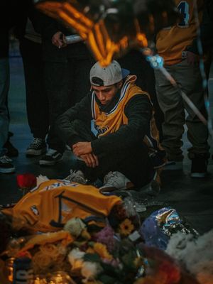 Fans at a Kobe Bryant memorial at Staples Center - Photograph by Fred Kearney
