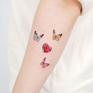 Tiny tattoo by Song E tattoo #songetattoo #studiobysol #tinytattoo #tattooswithmeaning #heart #butterfy
