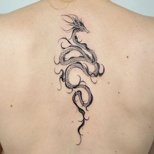 tribal dragon back tattoos for men