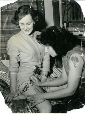 Jessie tattooing a butterfly on a female client’s leg #JessieKnight #ladytattooist #Britain’sfirstfemaletattooist #traditionaltattoos