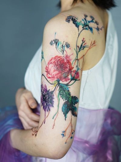 Watercolor tattoo by Denon Tattoo #DenonTattoo #Denon #watercolor #natural #organic #flowing #nature #floral #water #arm