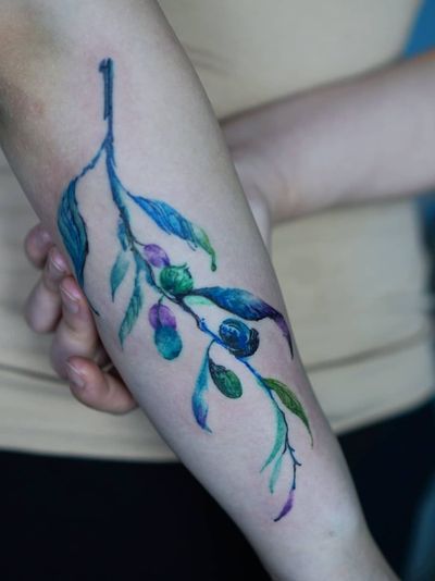 Watercolor tattoo by Denon Tattoo #DenonTattoo #Denon #watercolor #natural #organic #flowing #nature #floral #water #arm