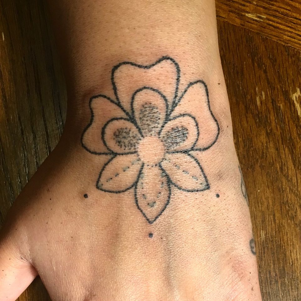 A Traditional Flower Tattoo by Multi-Disciplinary Artist Audie Murray #cree #michif #indigenousart #skindigenous #artist #stitching #saskatchewan #audiemurray #canada #handtattoo #wristtattoo