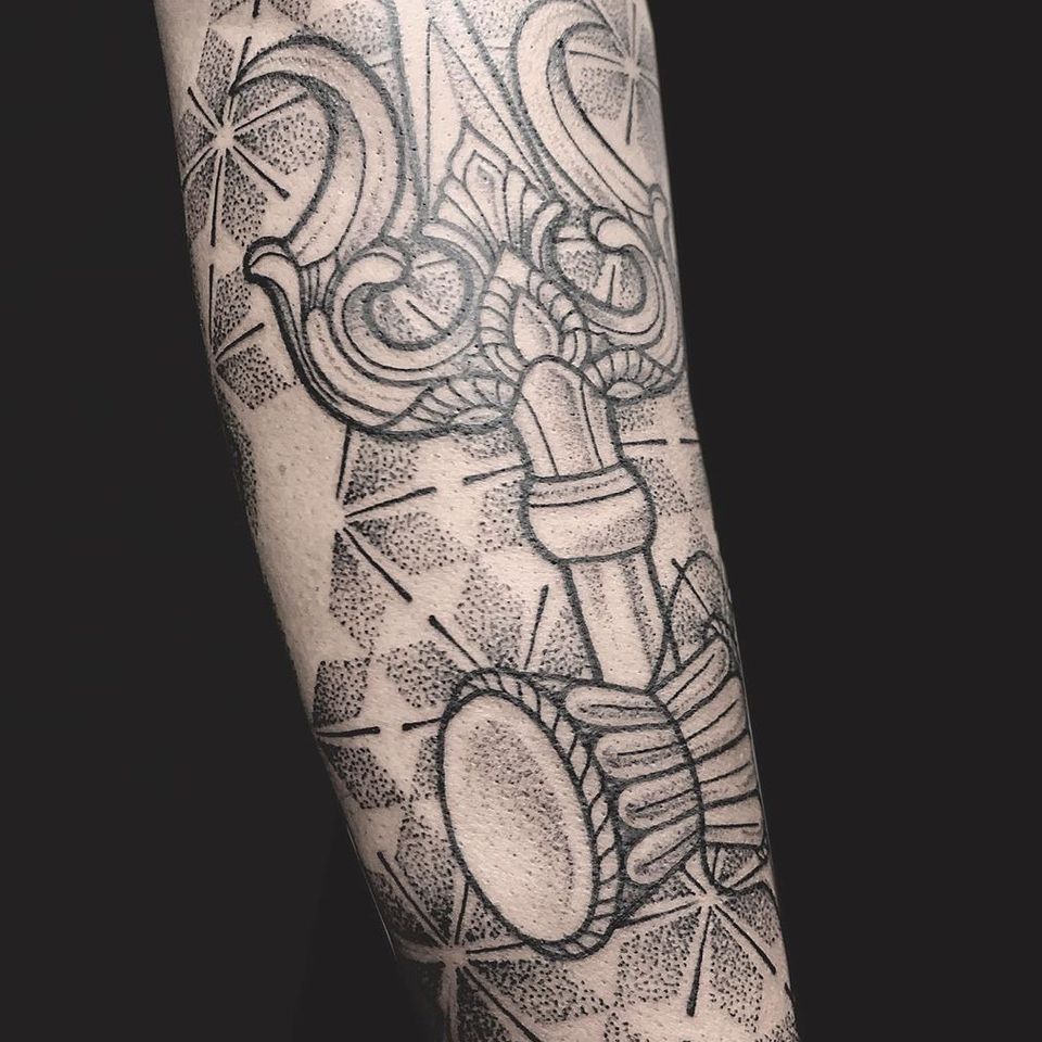 Trident tattoo by Rose Tattoo #RoseTattoo #tridenttattoo #trident #drum #sacredgeometry #dotwork #linework 