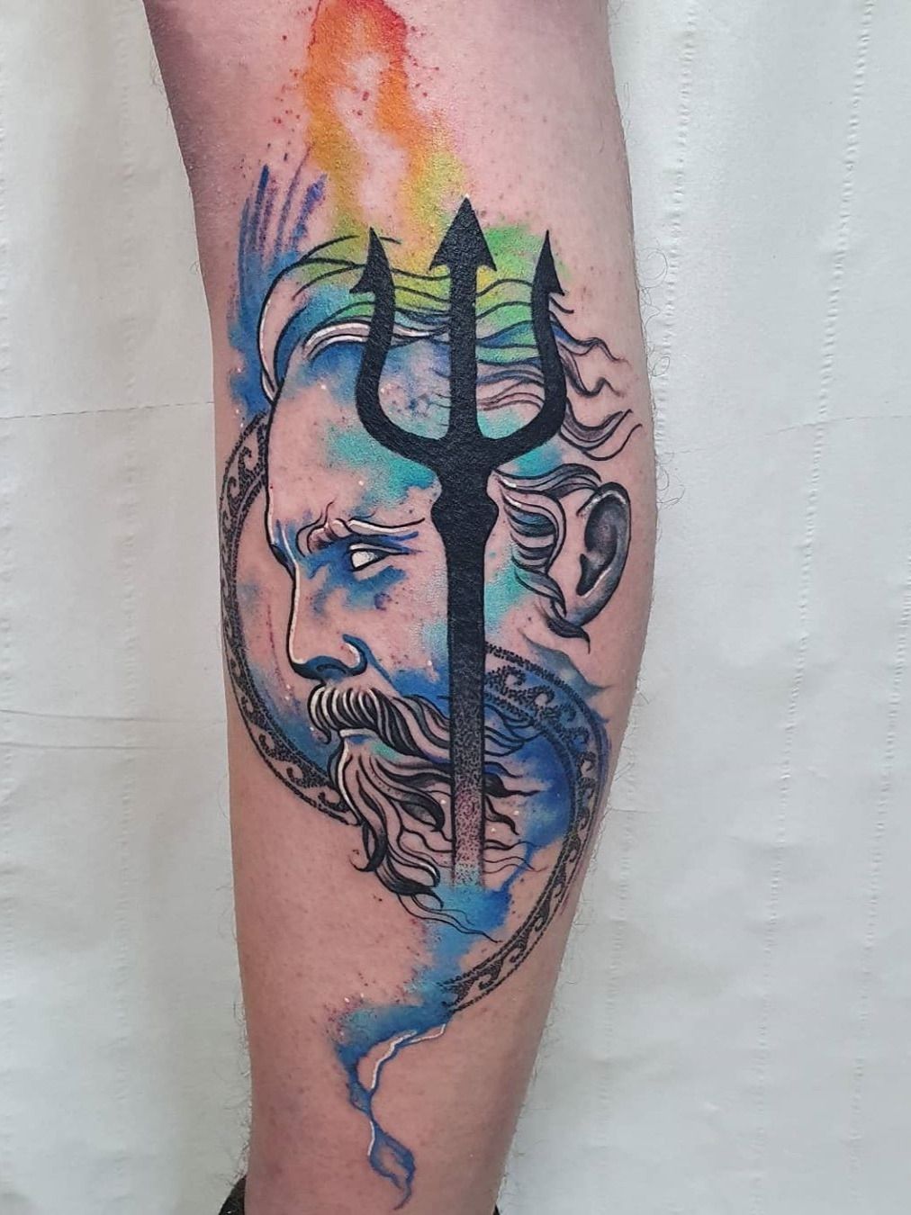 Bust of Neptune tattoo located on the inner forearm