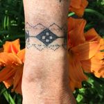 A Traditional Wrist Tattoo Design by Multi-Disciplinary Artist Audie Murray #cree #michif #indigenousart #skindigenous #artist #stitching #saskatchewan #audiemurray #canada #wristtattoo
