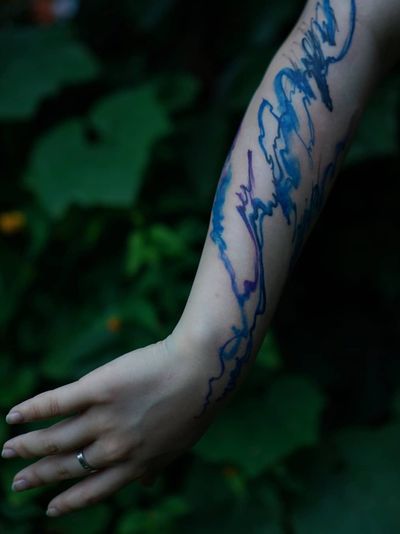 Watercolor tattoo by Denon Tattoo #DenonTattoo #Denon #watercolor #natural #organic #flowing #nature #floral #water #arm