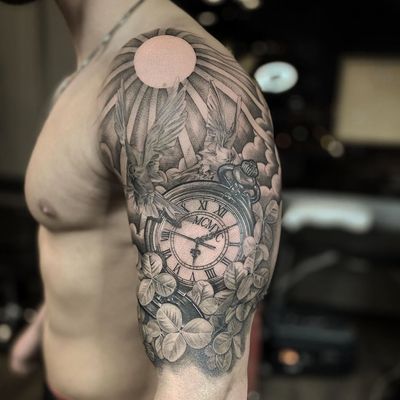 Angel and compass tattoo by Lil Jeon #LilJeon #blackandgrey #realism #compass #angel #flower #floral #bicep #arm 
