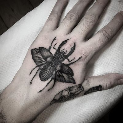 Beetle tattoo by Wulfbaron #Wulfbaron #darkart #japaneseinspired #illustrative #beetle #insect #hand 