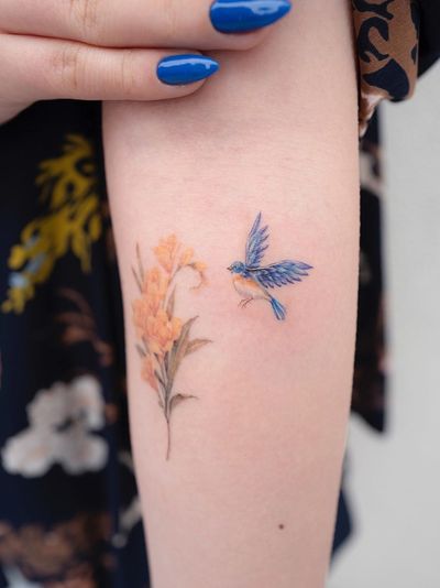 Little Tattoos — Watercolor style bluebird tattoo on the forearm.