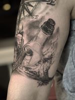 Message in bottle tattoo by Lil Jeon #LilJeon #blackandgrey #realism #bottle #glass #message #ocean #compass