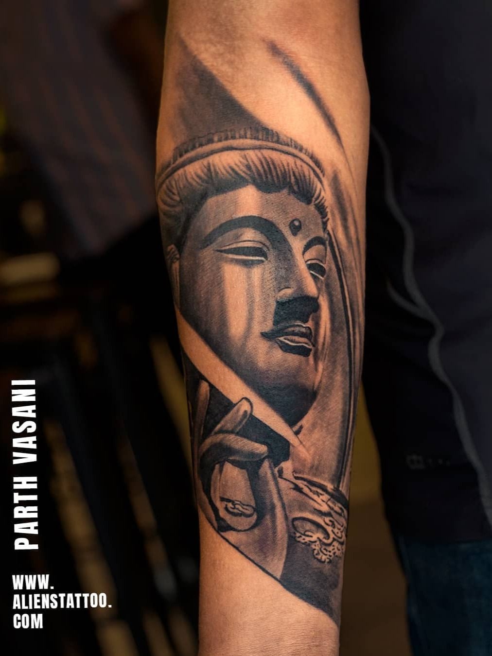 Buddha tattoo done on the inner forearm, illustrative