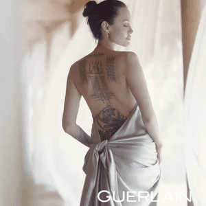 Angelina Jolie's real tattoo spotlit in a Guerlain campaign. #badasstattoos #femaletattoos #filmtattoos #Fox #wanted #angelinajolie