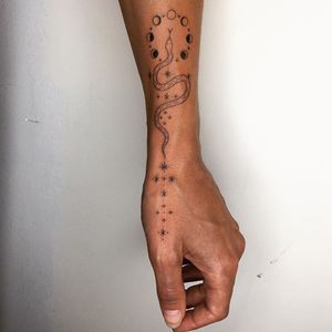 Snake tattoo by Tati Compton #TatiCompton #snake #stars #moonphase #moon #hand #wrist #sexualassaultawarenesstattoo #sexualassaultsurvivortattoo #survivortattoo #tattoosforstrength #selflove #empoweringtattoos