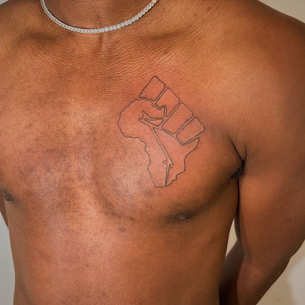 Tattoo uploaded by Jennifer R Donnelly  Black power fist in the shape of  Africa tattoo by csndramay csndramay africa africancontinent  blackpowerfist blackpower chestattoo linework  Tattoodo